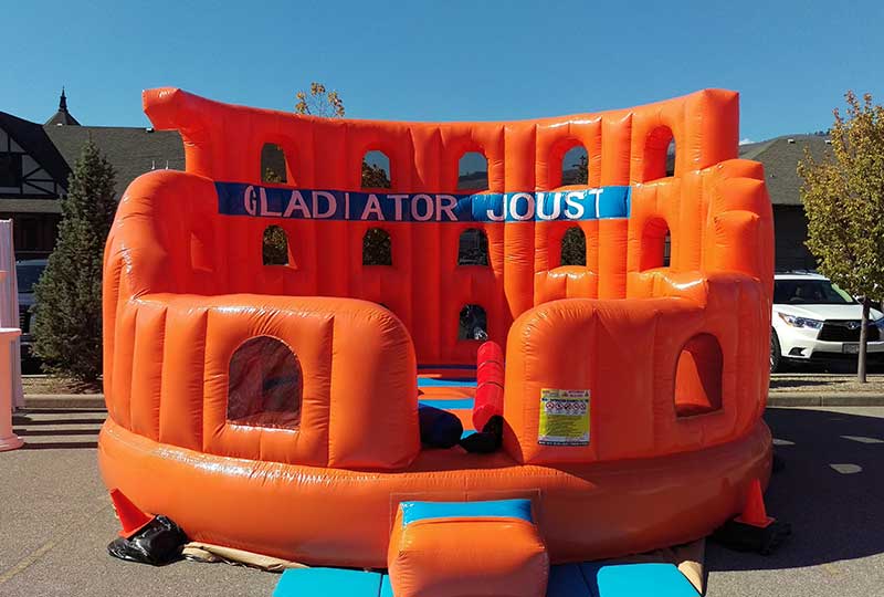 Interactive inflatable attractions at a carnival or fair.